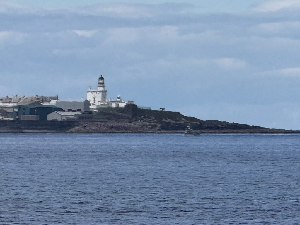 Kinnaird Head lighthouse at Fraserburgh standing over the North Sea beyond Philorth Beach