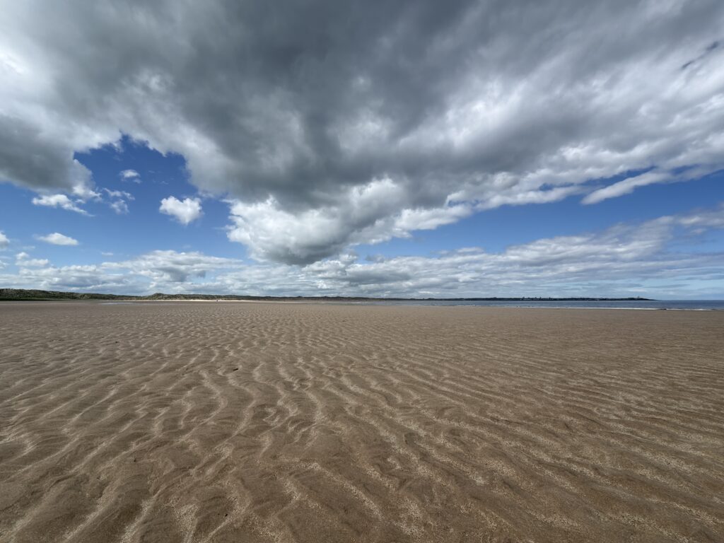 The long low-tide flats of Philorth Beach stretching out toward the North Sea