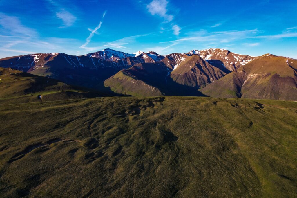 The van parked alone on the high plateau at dawn
