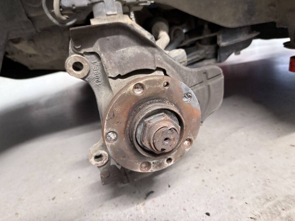 The damaged wheel hub that caused the lug nuts to shear
